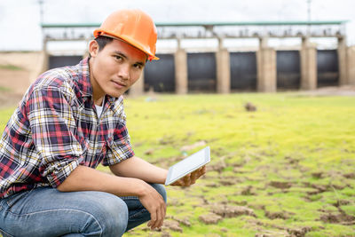 Side view of man using digital tablet