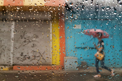 Full frame shot of wet window in rainy season