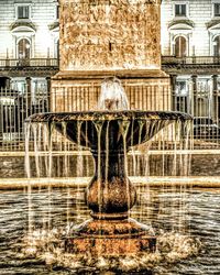 Building reflecting in water