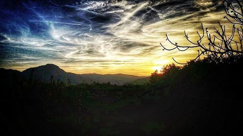 Scenic view of landscape against cloudy sky