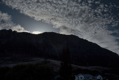 Scenic view of mountains against sky at dusk