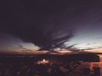 Scenic view of rocks against sky during sunset