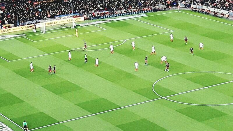 HIGH ANGLE VIEW OF PEOPLE PLAYING SOCCER