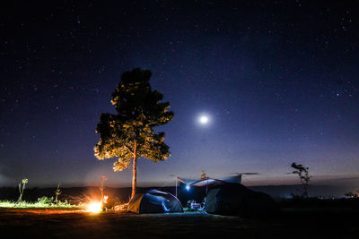 View of illuminated tent against sky at night