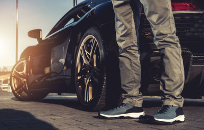 Rear view of man standing in car