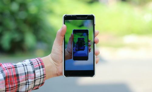 Close-up of hand holding smart phone