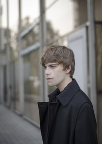 Portrait of young man standing outdoors