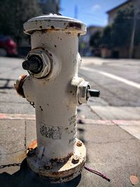 Close-up of fire hydrant on sidewalk