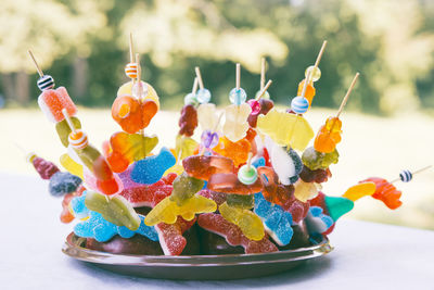 Close-up of multi colored candies in plate on table