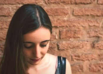 Close-up of young woman looking down