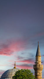 Low angle view of buildings against sky during sunset