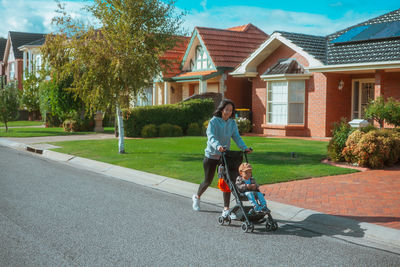 Rear view of woman walking on street