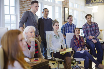 Business people listening in meeting at office