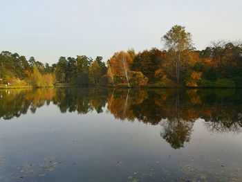 Reflection of trees in lake against sky during autumn