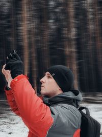 Portrait of young man in snow