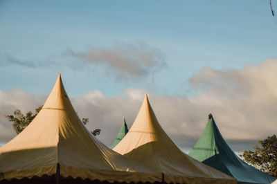 Low angle view of parasol against sky