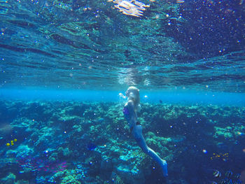 Woman swimming in sea