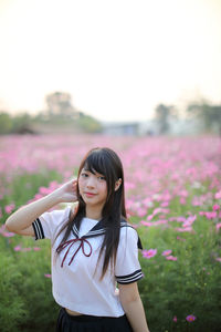 Beautiful woman standing on field