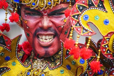 Close-up portrait of man in costume with face paint