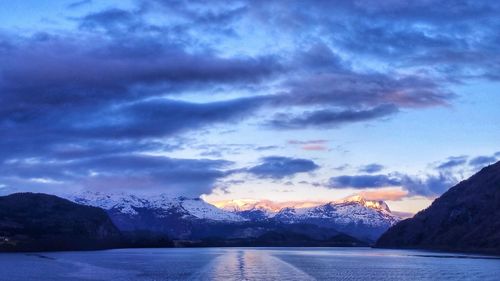 Scenic view of lake against sky during sunset