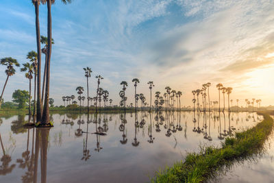 Scenic view of lake against sky during sunset