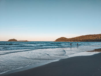 Scenic view of sea against clear blue sky