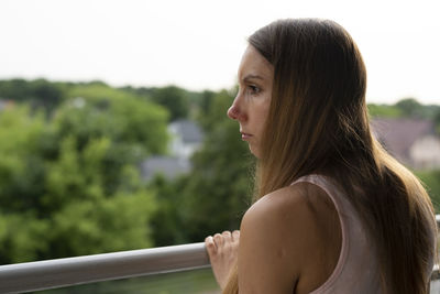 Portrait of young woman looking at camera