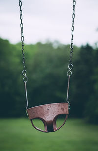 Close-up of swing in grass