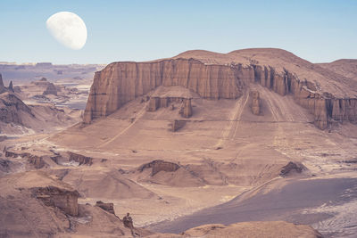 View of landscape with mountain range in background