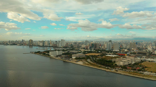 Aerial view of panorama of manila at sunset. skyscrapers and business centers in a big city. 