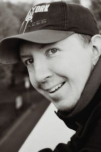 Close-up portrait of young man wearing cap