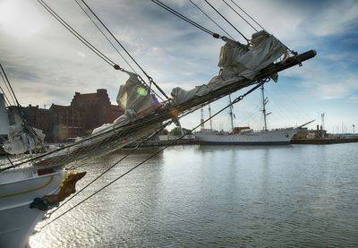 Boats moored at harbor