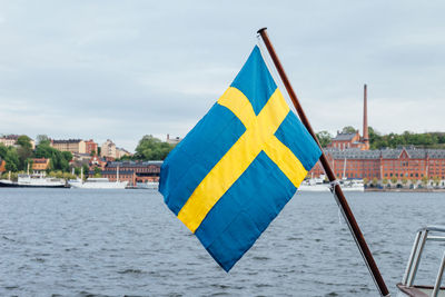 Swedish flag against sea