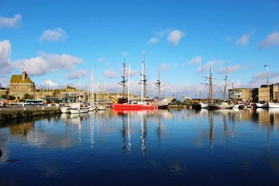 Boats moored at harbor