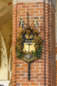 Close-up of carving on brick wall