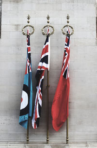 Flags hanging against wall