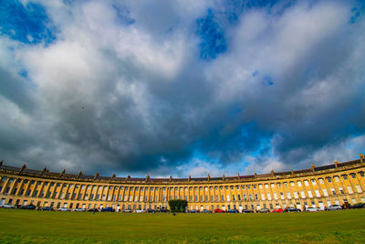 Low angle view of historical building against cloudy sky