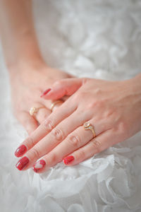 Closeup shot of the exchange of wedding or engagement ring
