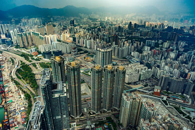 High angle view of modern buildings in city against sky