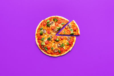 Directly above shot of pizza on blue background