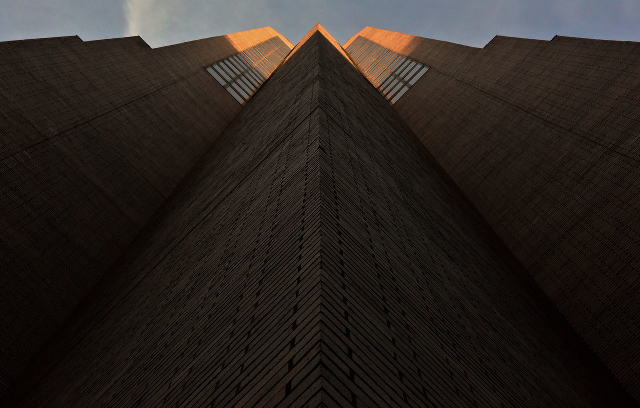 architecture, built structure, building exterior, low angle view, orange color, cloud, modern, sky, outdoors, architectural feature, geometric shape, repetition, no people, spire