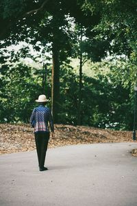 Full length of woman walking on footpath