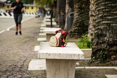 Stuffed toy on footpath in park