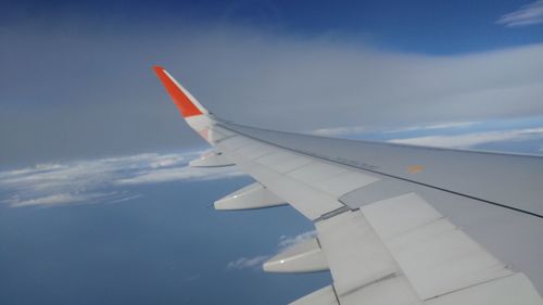 Low angle view of airplane flying in sky