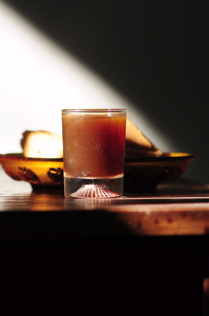 CLOSE-UP OF COFFEE CUP ON TABLE