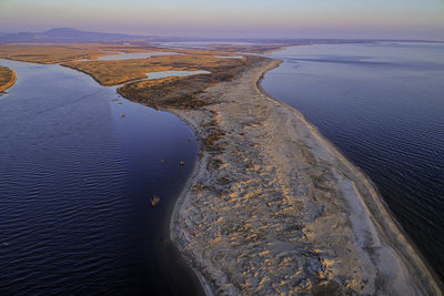 High angle view of beach against sky during sunset