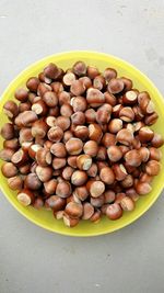 Directly above view of fresh chestnuts in plate on table