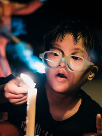 Autism boy playing with the sparkles at night