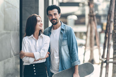 Young couple looking at camera