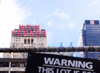 Low angle view of building against cloudy sky
